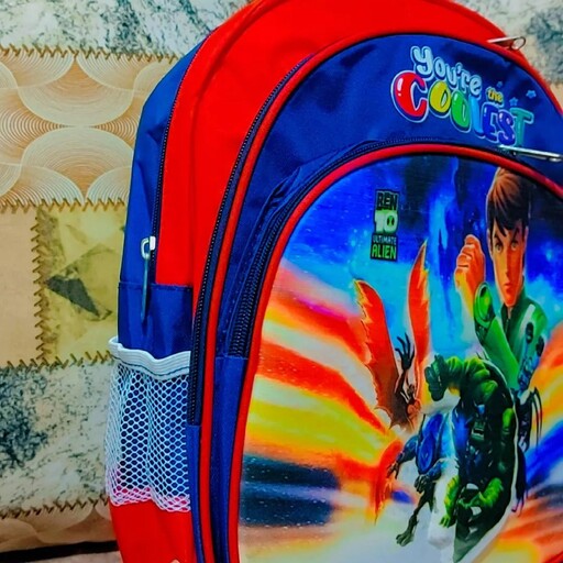 کیف مدرسه ای پسرانه طرح بن تن 3 زیپ رنگ ترکیبی سرمه ای و قرمز