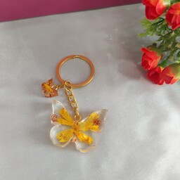 جا کلیدی رزینی طرح پروانه  ساخته شده از گل طبیعی و ورق طلا و اکلیل