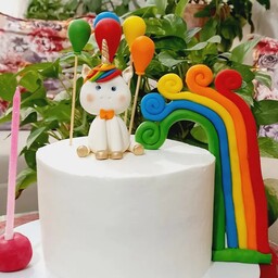 کیک تولد پونی و رنگین کمان (تاپر دست ساز فوندانتی) وزن کیک 1800 (ارسال به محمدیه رایگان و اطراف بصورت پس کرایه است)