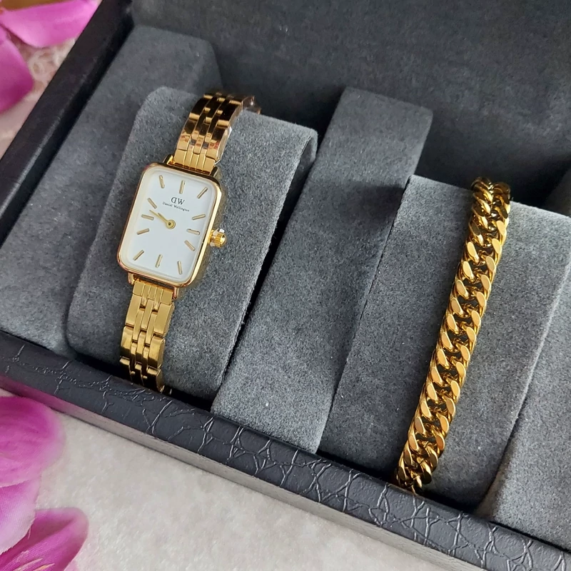 ساعت مچی زنانه DW طلایی صفحه سفید همراه دستبند کارتیر