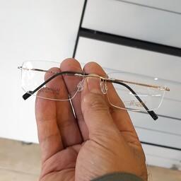 عینک طبی بی فریم رنگ طلایی  جنسیت فریم فلزی همراه با جلد و دستمال عینک 