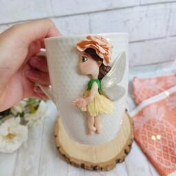 ماگ عروسکی دخترونه فرشته با خمیر پلیمری مناسب هدیه  روی لیوان سرامیکی سفید