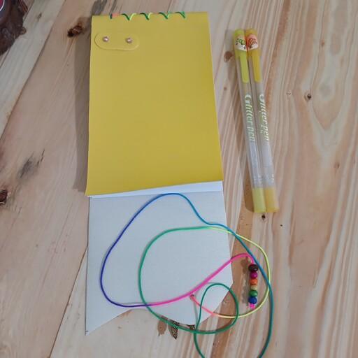 دفتر چرم زرد دستدوز با نخ رنگی،64 برگ،جنس کاغذ سفید بدون خط 
