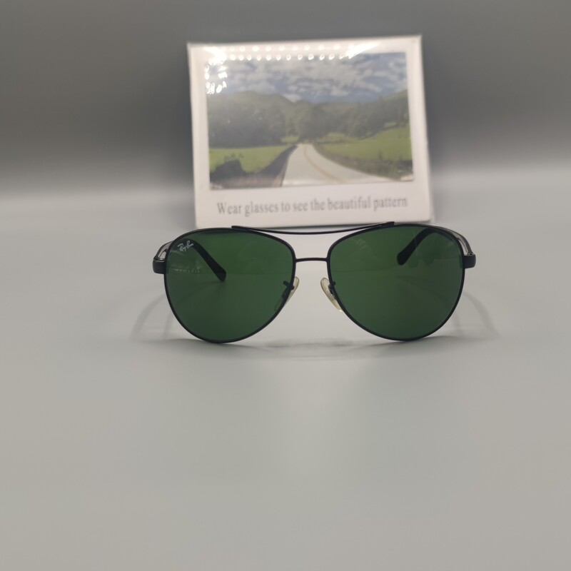 عینک آفتابی مردانه مدل ریبن شیشه سنگ سبز لجنی با فریم چهار پیچ فلزی مشکی رنگ با قاب و دستمال