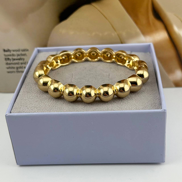 دستبند طلایی براق با مهره‌های توپی