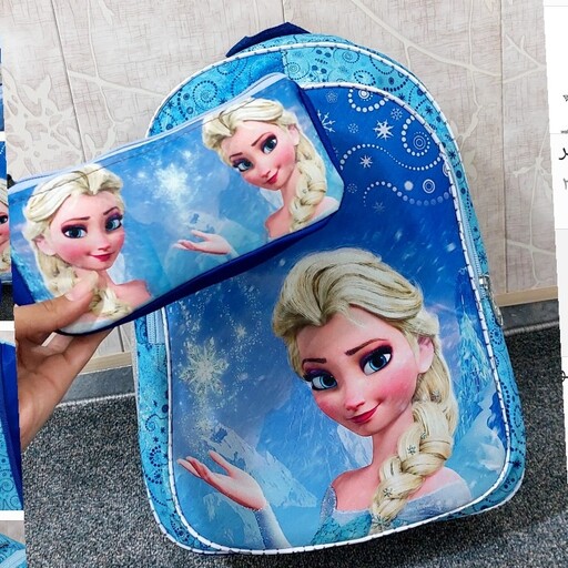 کیف مدرسه ای دخترانه دوزیپ طرح السا و آنا جنس خارجی همراه با جامدادی دارای پشتی طبی و بند راشل دار داخل آستردوزی رنگ آبی