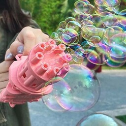 اسباب بازی تفنگ حباب ساز  باطری خوربه همراه مایع حباب ساز 