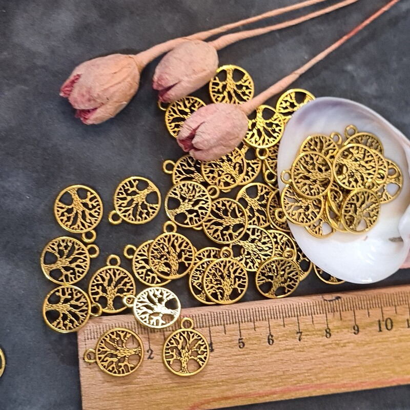 خرجکار درخت سکه مانند حلقه دار مدال ، مناسب ساخت زیورلات وانواع کارهای هنری قیمت 8عددی می باشد .