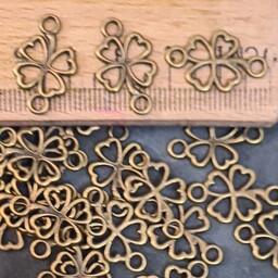 خرجکار شبدرچهار پَر برنزی دو حلقه دار،بین کاری مناسب ساخت دستبندوکارهای هنری(قیمت برای  پَک 18 عددی  )