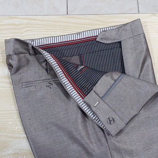 شلوار پارچه ای مردانه رنگ بژ کم رنگ نیمه براق تا براق سایز 44