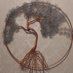 درخت سیمی(بنسیم)این دیوارکوب درخت تو یه حلقه فلزی فیکس شده،رنگ تنه مسی و شاخ و برگ نقره ای،با قطر30سانت