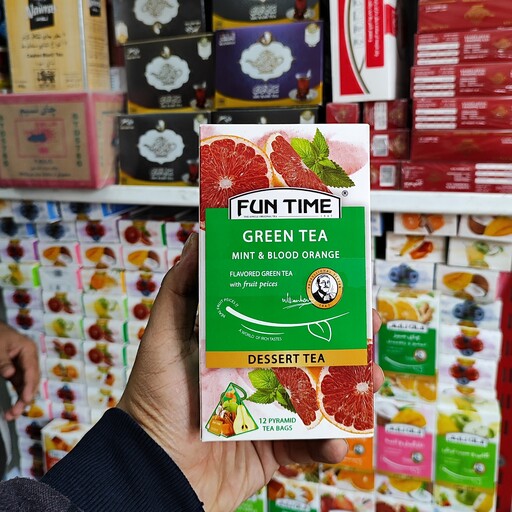 چای سبز طعم دار با تکه های میوه   (پرتغال و نعنا) کیسه ای - 12 عددی کارتن 50 گرمی 