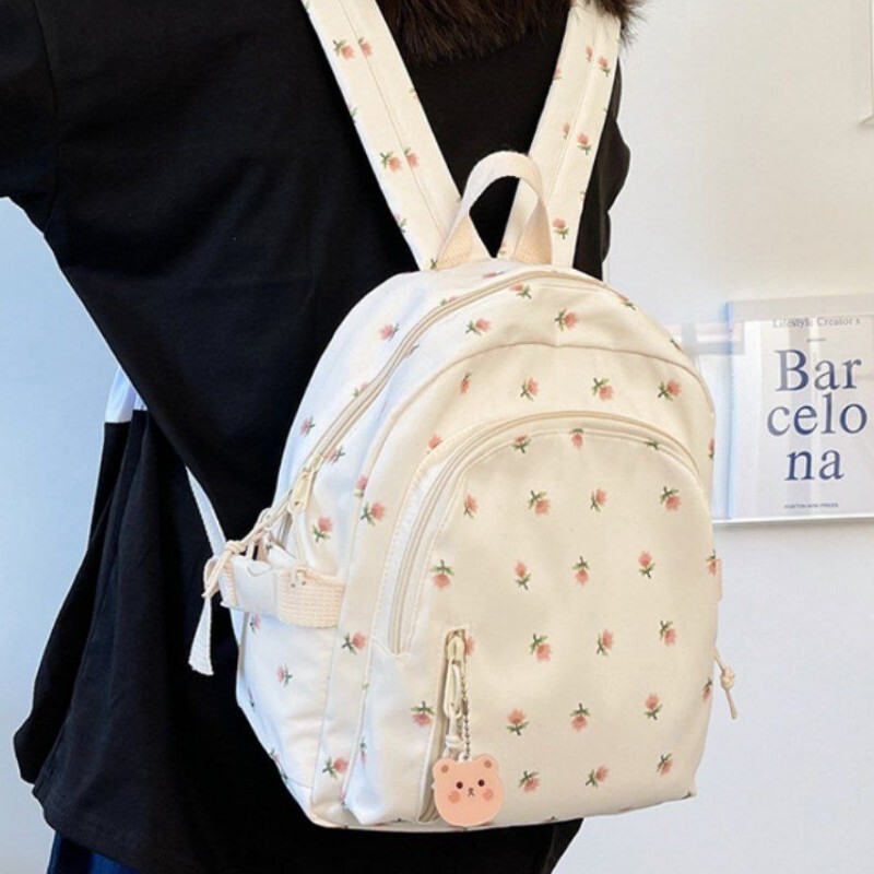 مینی کوله پشتی وارداتی شکوفه ای رنگ های سفید مشکی آبی صورتی همراه با آویز کیف وارداتی کوچک خاص و زیبا کیف مدرسه 