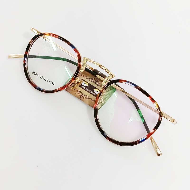 عینک طبی گرد سایز کوچک با قابلیت تعویض عدسی های جدید نمره دار جنسیت فریم فلزی دور حدقه کایوچویی دارای روبینی قابل تنظیم 