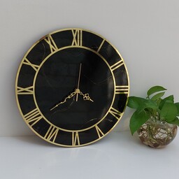 ساعت دیواری رزینی(قطر40سانتی)،جنس چوب ورزین،رنگ مشکی با خطوط طلایی،آیینه ای وشفاف