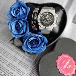 باکس هدیه مردانه شامل ساعت هابلوت شیک مردانه و یک دستبند و گل