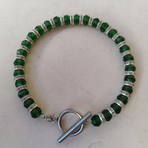 نیم ست دستبند و گوشواره مهره کریستالی سبز مدل حلقه