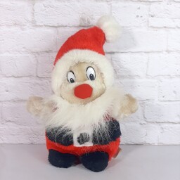 عروسک بابانوئل بسیار با کیفیت و زیبا خز  موئی بلند د براق مدلش ایستاده است با چشم های پلاستیکی 