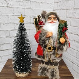 عروسک بابانوئل با چوب اسکی کادویی