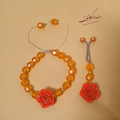 ست دستبند و گیره روسری نارنجی دخترانه گل پاستیلی گلابتون