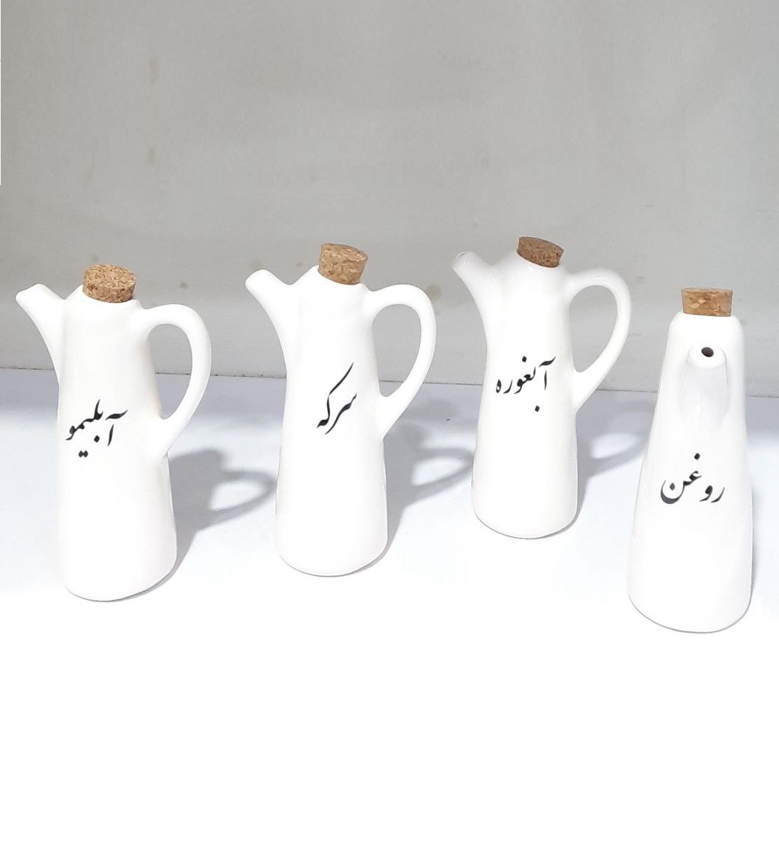 - ظرف مایعات سرامیکی دسته دار تکست مبلمونسرا مدل 279311