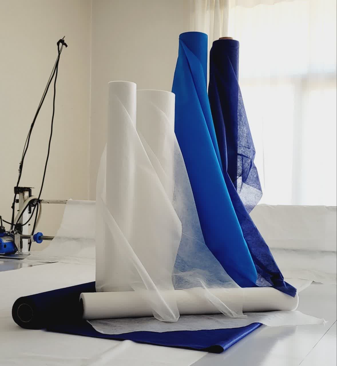 رول یکبار مصرف تخت معاینه 20 متری عرض 60 سفید و آبی 25 گرم