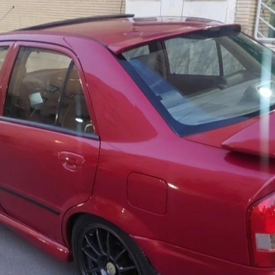 تصویر بال عقب شیشه مزدا 323 رنگ شده ارسال بصورت پس کرایه 