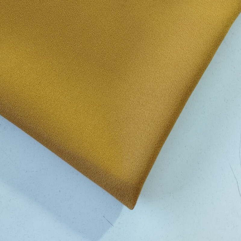 پارچه کرپ اسکاچی درجه یک رنگ خردلی قیمت به ازای ده سانتی متر می باشد