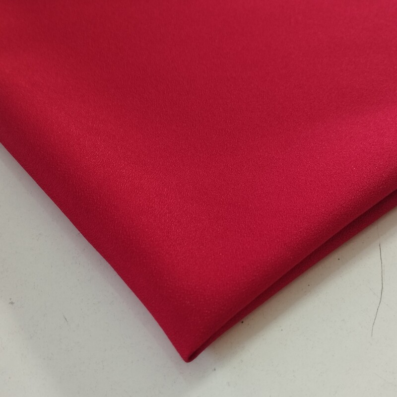 پارچه کرپ اسکاچی درجه یک عرض 150 رنگ قرمز قیمت به ازای ده سانتی متر می باشد