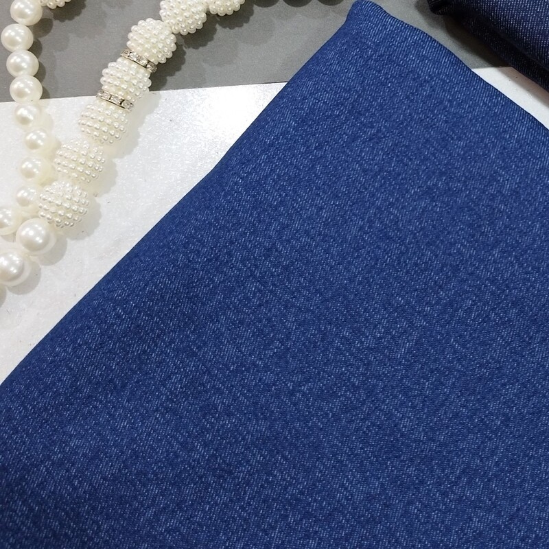پارچه لی جین ضخیم با کیفیت بالا رنگ آبی تیره عرض 150 قیمت به ازای ده سانتی متر می باشد