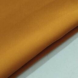 پارچه کرپ مازراتی درجه یک رنگ انبه ای عرض 150 قیمت برای ده سانتی متر است