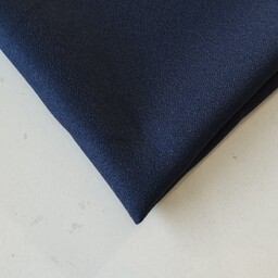 پارچه کرپ اسکاچی درجه یک رنگ سورمه ای عرض 150 قیمت برای یک متر می باشد