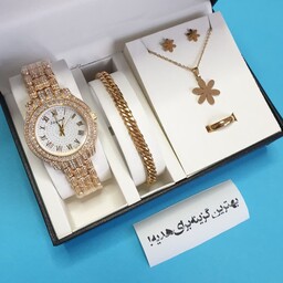 ساعت زنانه مجلسی بند استیل طلایی نگین دار همراه با نیم ست و دستبند 
