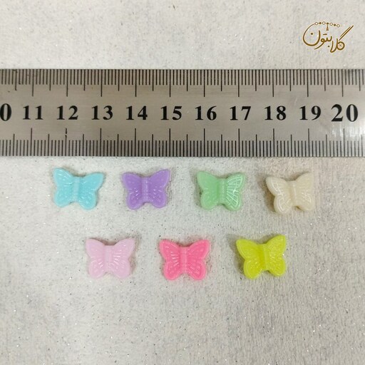 مهره دستبند پاستیلی طرح پروانه هر بسته 20 گرم، حدود 85 عدد