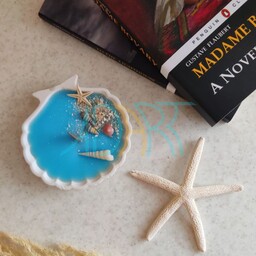 شات شمع صدف دریایی همراه با تزئینات صدف و ستاره دریایی 