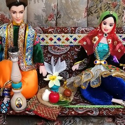 عروسک سنتی نشسته بر تخت وهفت سین دار 