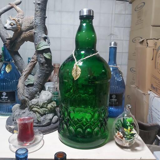 بطری و قرابه شیشه سبز دست ساز پرس فوتی 6 لیتری با دو درب چوب پنبه و استیل  جنس خود بطری سبز هست و رنگ نشده 