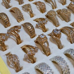 عمده فروش عمده انگشتر زنانه طلاروس بسیار با کیفیت صددرصد رنگ ثابت فروش بصورت قاطی حداقل تعداد سفارش 5 عدد