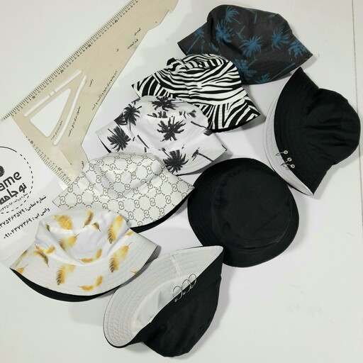 کلاه ماهیگیری باکت پارچه  کجراه پرسینگدار سفید مشکی و طرحهای طبق عکس 