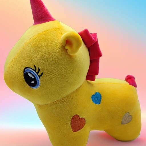عروسک اسب تکشاخ زرد رنگ قلب دار 