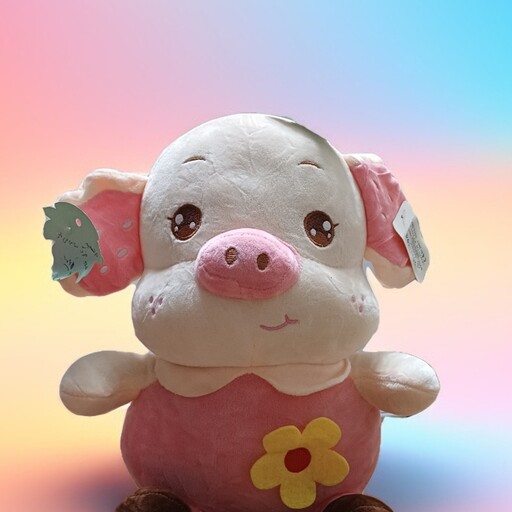 عروسک خوک با لباس گلدار صورتی .