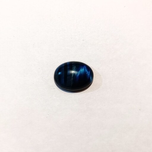 نگین سنگ معدنی چشم ببر  رنگ شده آبی تراش دامبله کد TE019