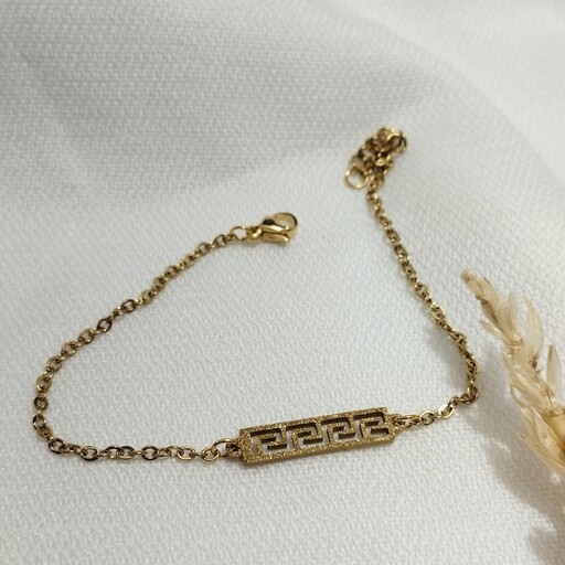 دستبند زنانه استیل سند پلاس طلایی طرح ورساچه 