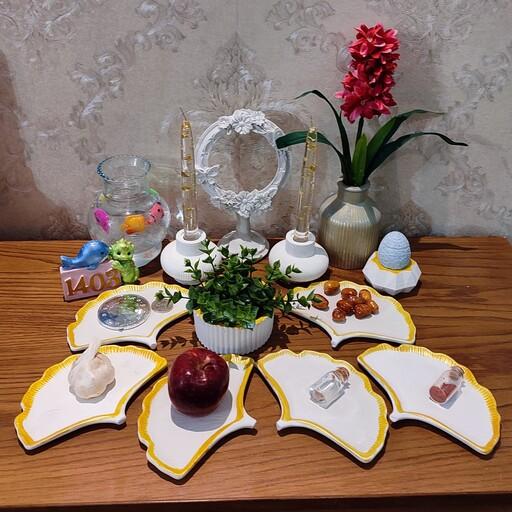 ست کامل هفت سین طرح برگ جینگو به همراه گلدان با گل سنبل و نماد سال 