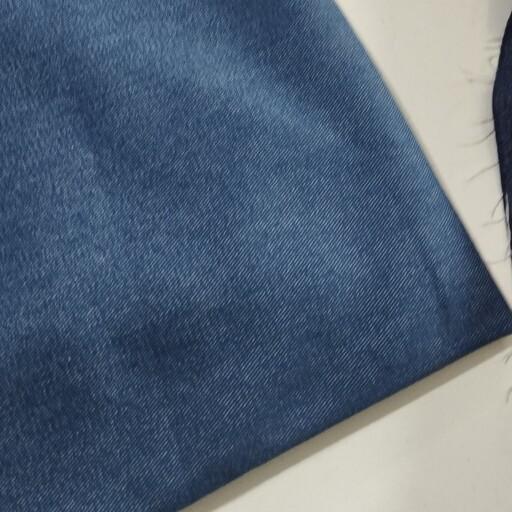 پارچه لی جین گرم بالا تک رنگ رنگ آبی پر رنگ قیمت به ازای نیم متر 