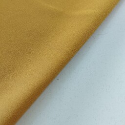 پارچه کرپ اسکاجی گرم بالا تک رنگ رنگ زرد خردلی قیمت به ازای نیم متر 