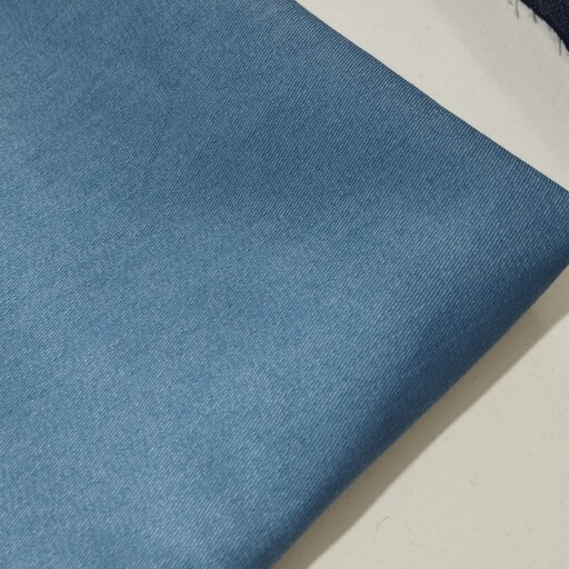 پارچه لی جین گرم بالا تک رنگ رنگ آبی روشن قیمت به ازای 10 سانت 
