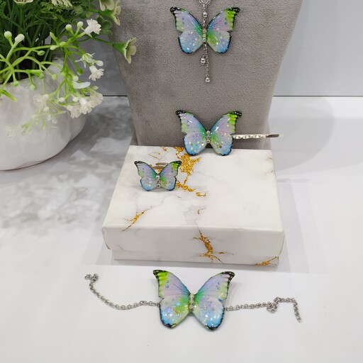 ست پنج تکه پروانه سفید هفت رنگ شاین دار شامل گردنبند،دستبند،گوشواره اتصالات رنگ ثابت و گیرمو و انگشتر هدیه