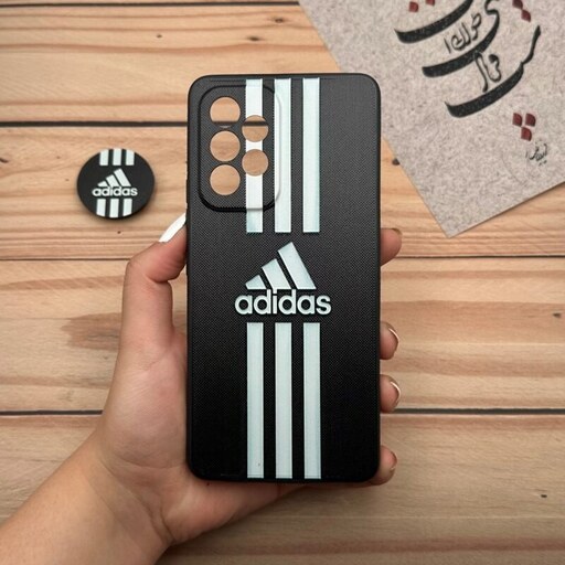 قاب گوشی Galaxy A53 5G سامسونگ فانتزی سوزنی برجسته طرح آدیداس Adidas پاپ سوکت دار کد 26702