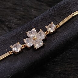 دستبند جواهری زنانه و دخترانه مجلسی نگین درشت طلایی طرح گل ،  استیل رنگ ثابت